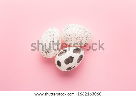Painted eggs on pink background. Easter holiday concept