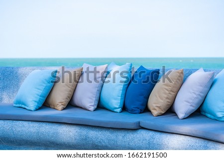 Pillow on chair or sofa lounge around outdoor patio with sea ocean beach view for travel