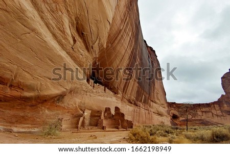 Long abandoned ruins of the Anasazi in Canyon de Chelly. This particular pueblo is called The White House. Royalty-Free Stock Photo #1662198949