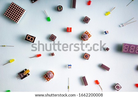 Micro electronics arduino DIY components on a light background, top view, copy space. Microcontrollers, boards, sensors, leds, controllers Royalty-Free Stock Photo #1662200008