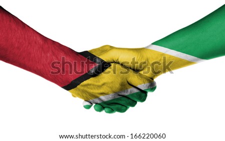 Man and woman shaking hands, wrapped in flag pattern, Guyana
