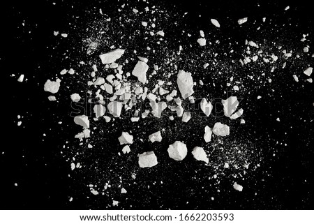 Rock stone broken splash explosion isolated on black background Royalty-Free Stock Photo #1662203593