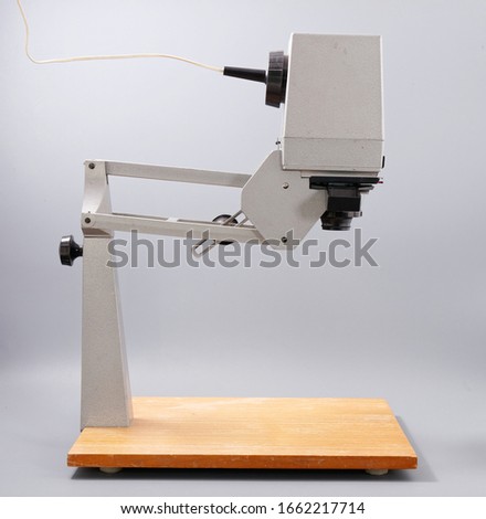 retro device for printing photos on a gray background