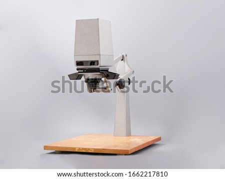 retro device for printing photos on a gray background