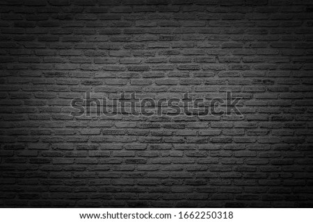 Old brick black color wall. Vintage background Royalty-Free Stock Photo #1662250318