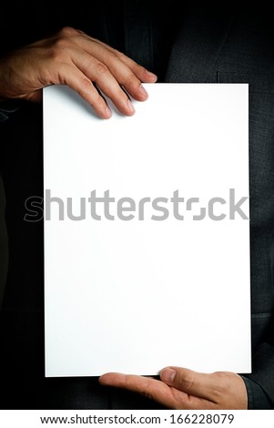 man holding a sheet of paper