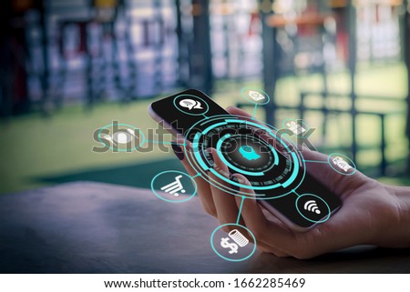 Business Women use smart phone technology with Internet of things futuristic  concept. One finger click on digital screen. free space for text.  Blurred gentle artistic nature  background