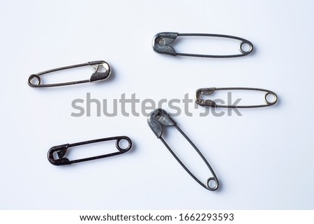 Old 5 Safety pin Isolated on white background, Close up and Macro shot, About, Tailor concept