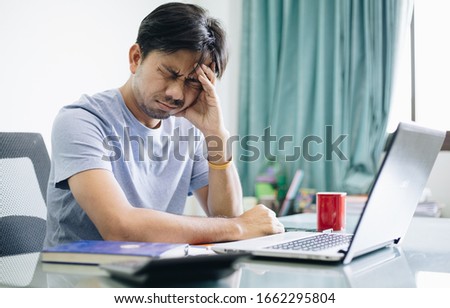 Asian men are stressed from work, Office Syndrome Royalty-Free Stock Photo #1662295804