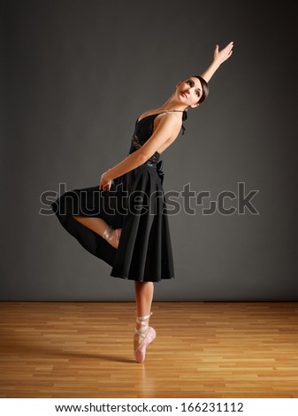Young ballerina in black costume
