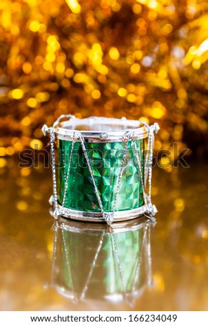 Christmas drums on golden background