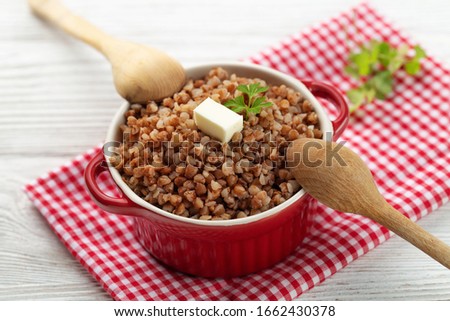 Buckwheat porridge with butter in bawl - breakfast, healthy food.   Royalty-Free Stock Photo #1662430378