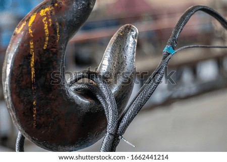 Industry. Lifting mechanisms. Metal hook. Close-up.