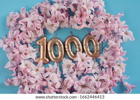 1000 followers card. Template for social networks, blogs. Background with pink flower petals. Social media celebration banner. 1k online community fans. 1 thousand subscriber