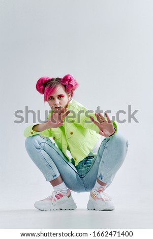 young woman in blue jeans isolated background