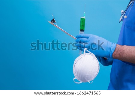 scientist holding syringe or injection, mask and reports, virus concept, vaccine and medical treatment