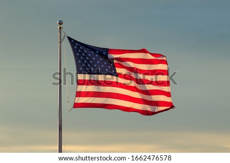 U.S. Flag and Sky at Sunset