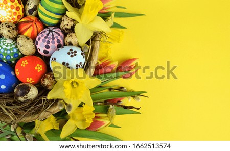 Happy Easter - painted eggs on colored background