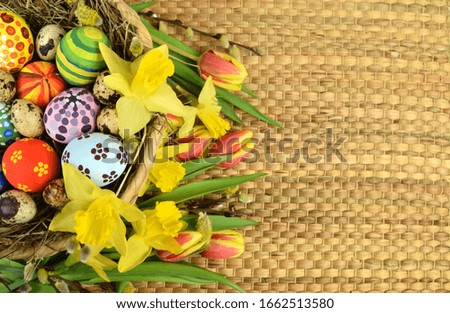 Happy Easter - painted eggs on colored background