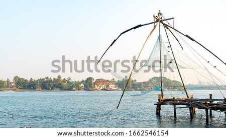 A morning picture of the Chinese fishing net or Cheenvala for locals in Vasco Da Gama Square at Fort Kochi, Kerala, India is one of the most popular and iconic attractions for tourists in Kochi. 