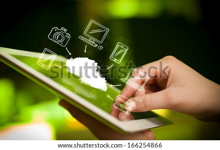 Hand touching tablet pc, mobile cloud concept