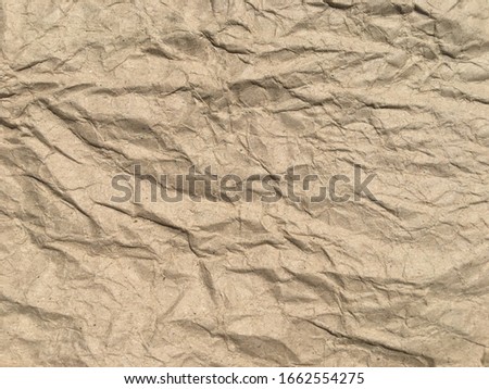 Brown crumpled paper background with copy space for Design. Wrinkled wallpaper Pattern