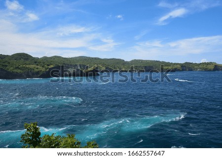 NUSA PENIDA, BALI, INDONESIA: 4/21/2019: Picture of colorful coastline with blue sky background, Nusa Penida, Bali, Indonesia