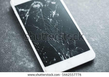 broken smart phone on the table