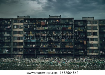 Living in poverty. Gypsy ghetto Lunik IX in Kosice - shabby prefab house with garbage. Royalty-Free Stock Photo #1662564862