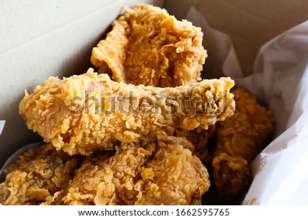 Delicious Crispy Fried Chicken in delivery box.