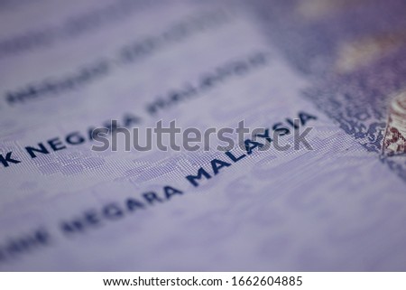 Malaysia currency of Malaysian ringgit banknotes background. Paper money of hundred ringgit notes etreme closeup. Financial concept.