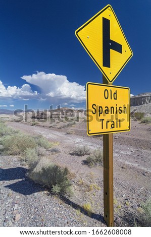 Old Spanish Trail Highway road sign in the Mojave desert near Tecopa at the intersection with Highway 127.