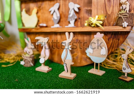 Easter decorative elements, painted eggs, wooden hen, bunny and chicken toys