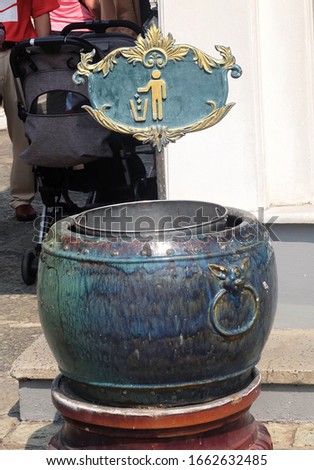 February 9, 2019 : Buckets or Garbage Bin, Wastebin, Recycling Bin in Vintage Style in Wat Phra Kaew Temple and The Grand Palace at Bangkok, Thailand.