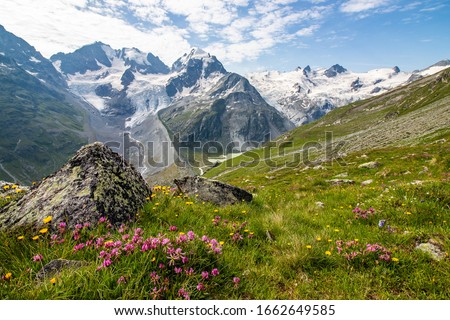 Beautiful mountain hike through Val Roseg along glacier near St. Royalty-Free Stock Photo #1662649585