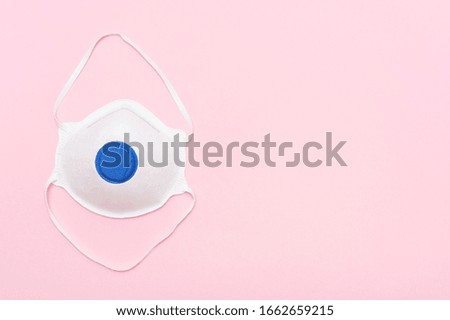Mask on pink background. Coronavirus or Covid-19 virus concept