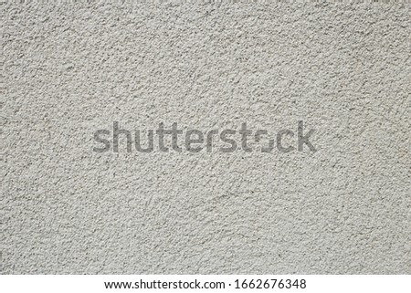 A uniform rough and grey cement surface. for background or resource materials and construction styles
