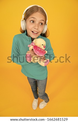 Valentines Day provide her the gift. Happy child hold valentines gift yellow background. Gift shop for kids. Love you teddy bear. Only gift I can give you is my heart.
