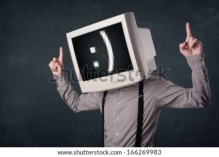 Funny young businessman with a monitor on his head and smiley on the black screen