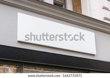 Blank store signage sign design mockup isolated, Clear shop template. Street hanging mounted on the wall. Signboard for logo presentation. Metal cafe restaurant bar plastic badge black white.  Royalty-Free Stock Photo #1662735871