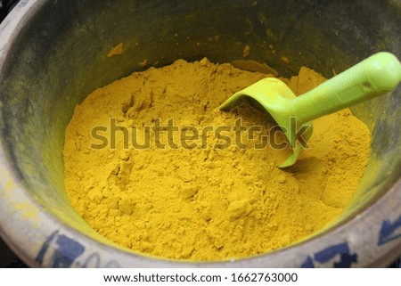 A picture of tumeric powder taken in a shop in Little India in Georgetown Malaysia