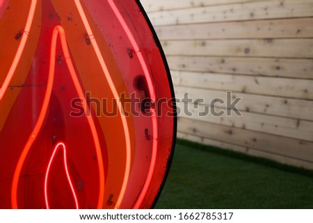 A large neon sign made to look like a campfire. 