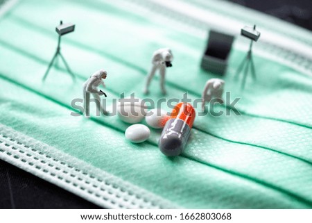 Miniature people: Worker support and drug with copy space using as background mask, medical technology, business adviser, health care concept.