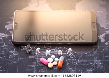 Miniature people: Worker support and drug with copy space using as background smart phone , medical technology, business adviser, health care concept.