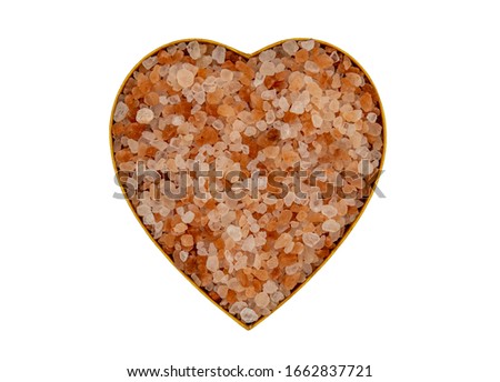 Pink Himalayan Salt in a heart shape isolated on white background. Valentines Day.
