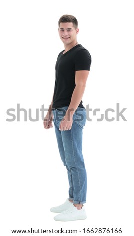 in full growth. casual smiling guy in black t-shirt