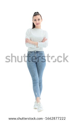 in full growth.a pretty young woman in casual clothes
