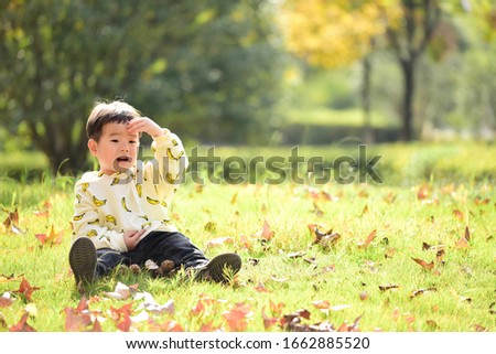 Happy children sitting on the grass