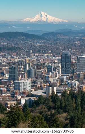 Downtown Portland, Oregon with Mount Hood in the background as seen from the Pittock Mansion viewpoint.
