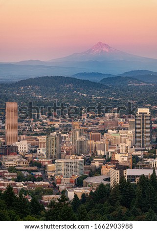 Downtown Portland, Oregon with Mount Hood in the background as seen from the Pittock Mansion viewpoint.